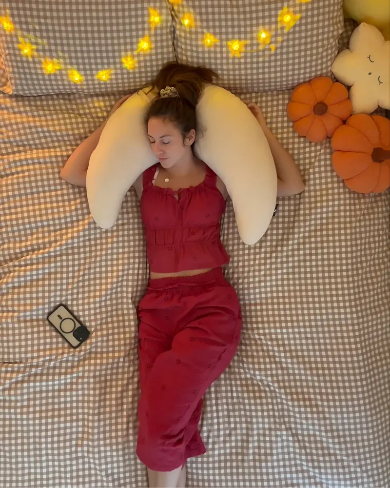 Mini Moon™ pillow wrapped behind the neck and shoulders