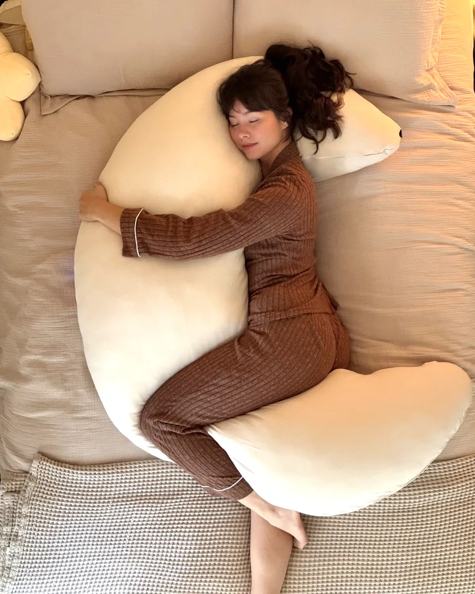 Facing the MoonSpoon on her side: arms around the top of the crescent, a knee over the bottom